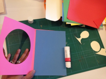 3. Stick another coloured A5 piece of paper onto the solid half of your card.